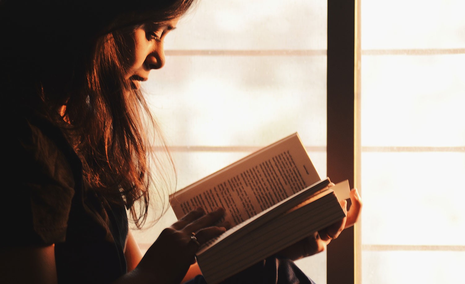 An introvert reads a book