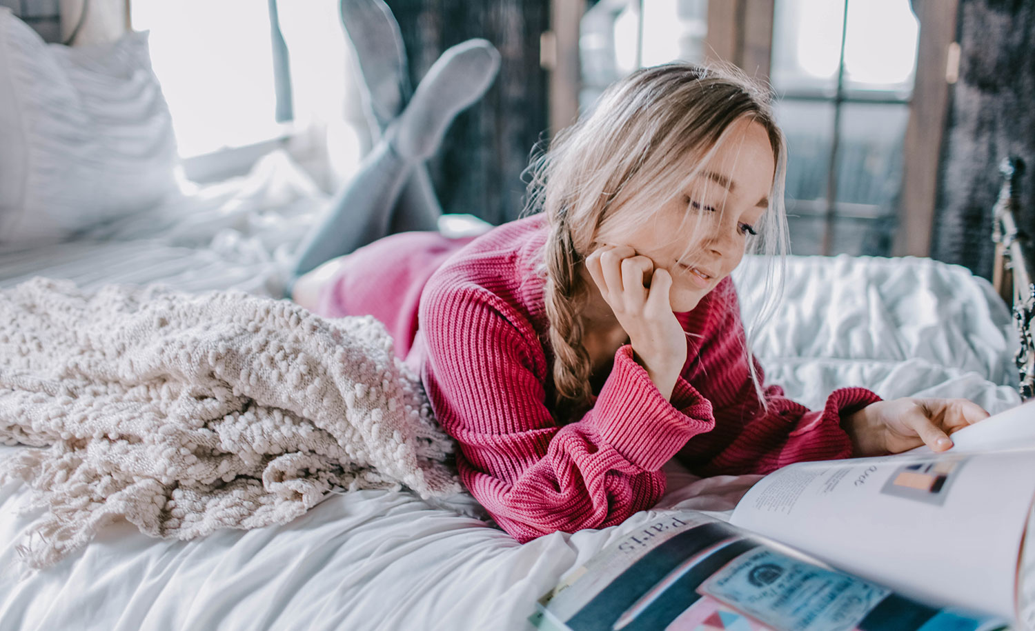 An introvert reads a magazine