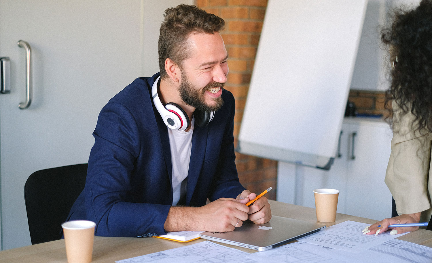An introverted employee smiles at a coworker