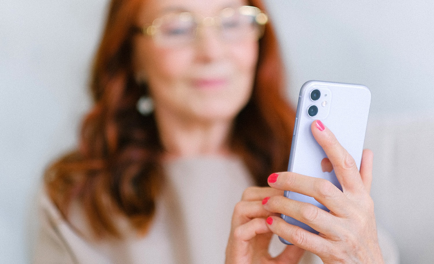 An introvert scrolls through social media on her phone