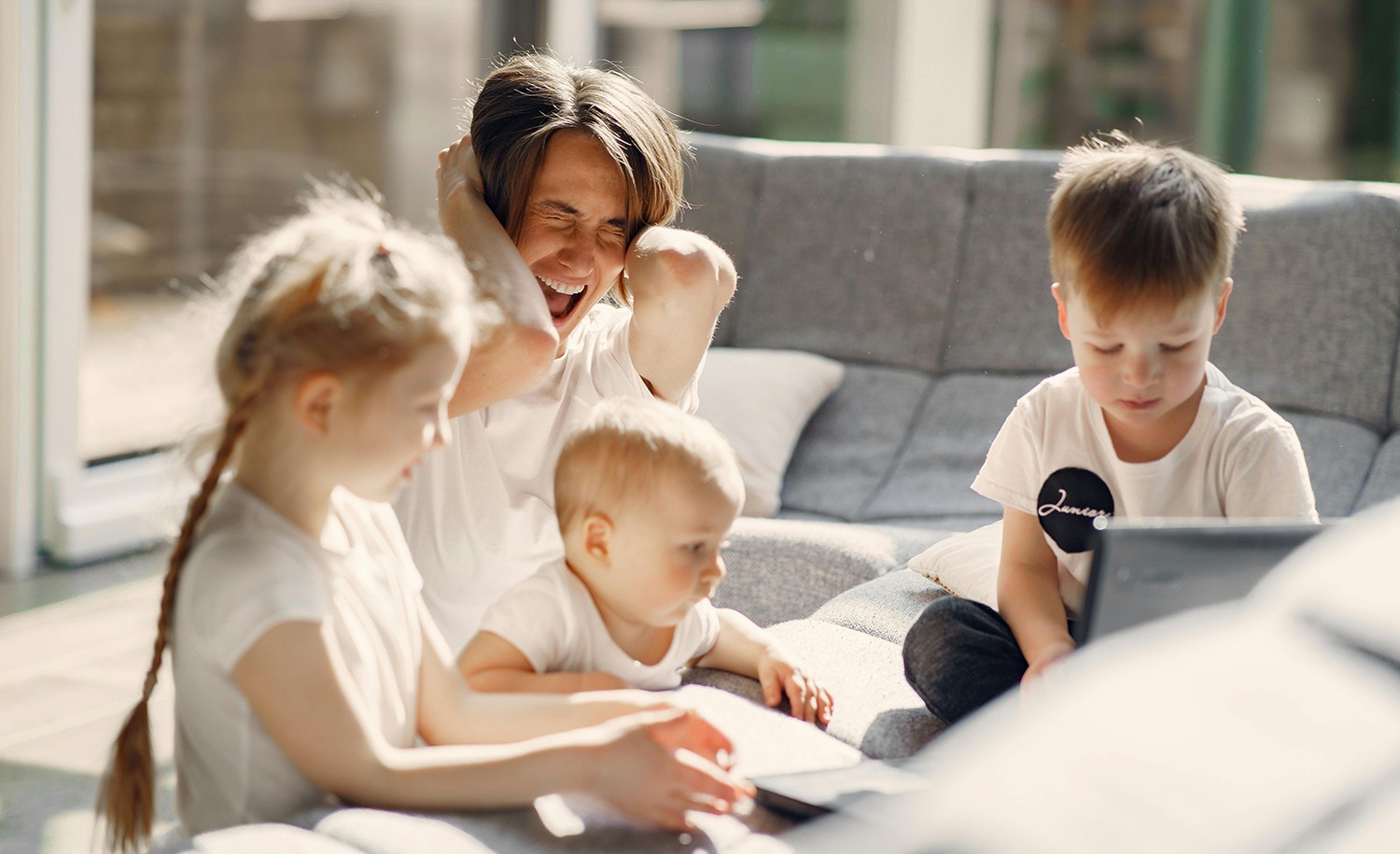 An overwhelmed highly sensitive, introverted parent with her children