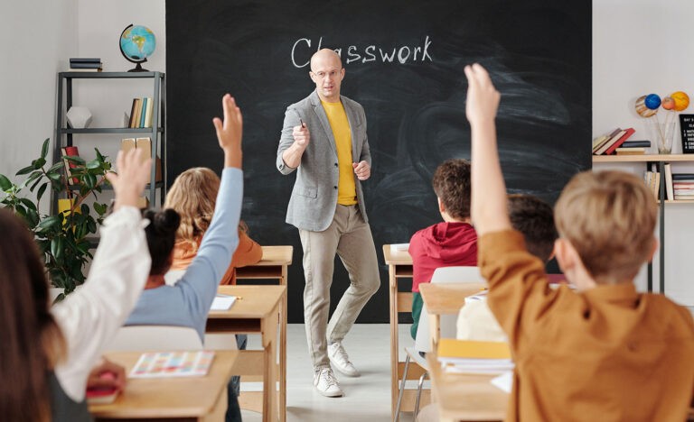 A man teaches in a classroom