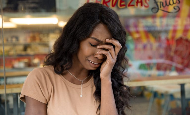 An introvert cries after a breakup.