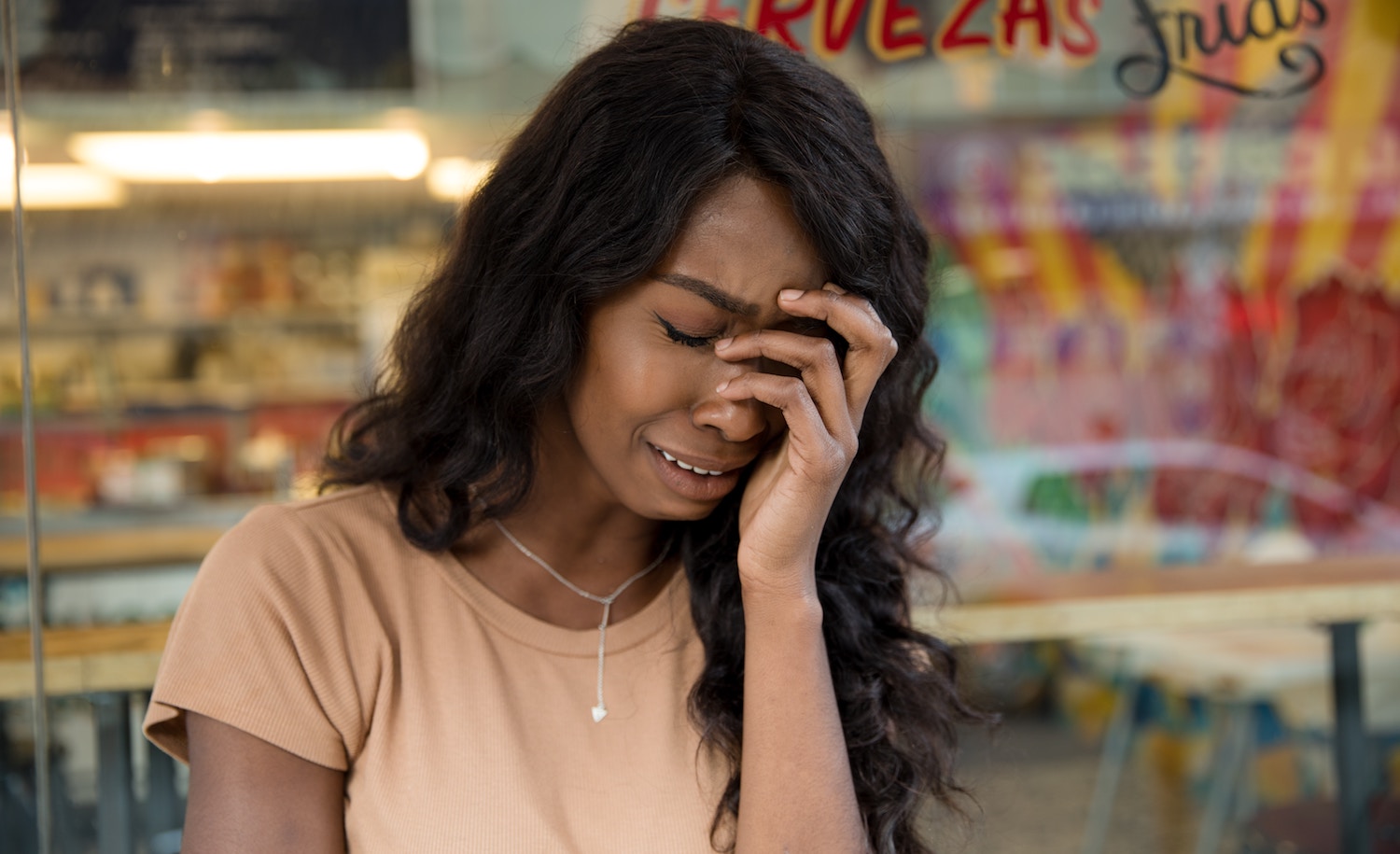 An introvert cries after a breakup.