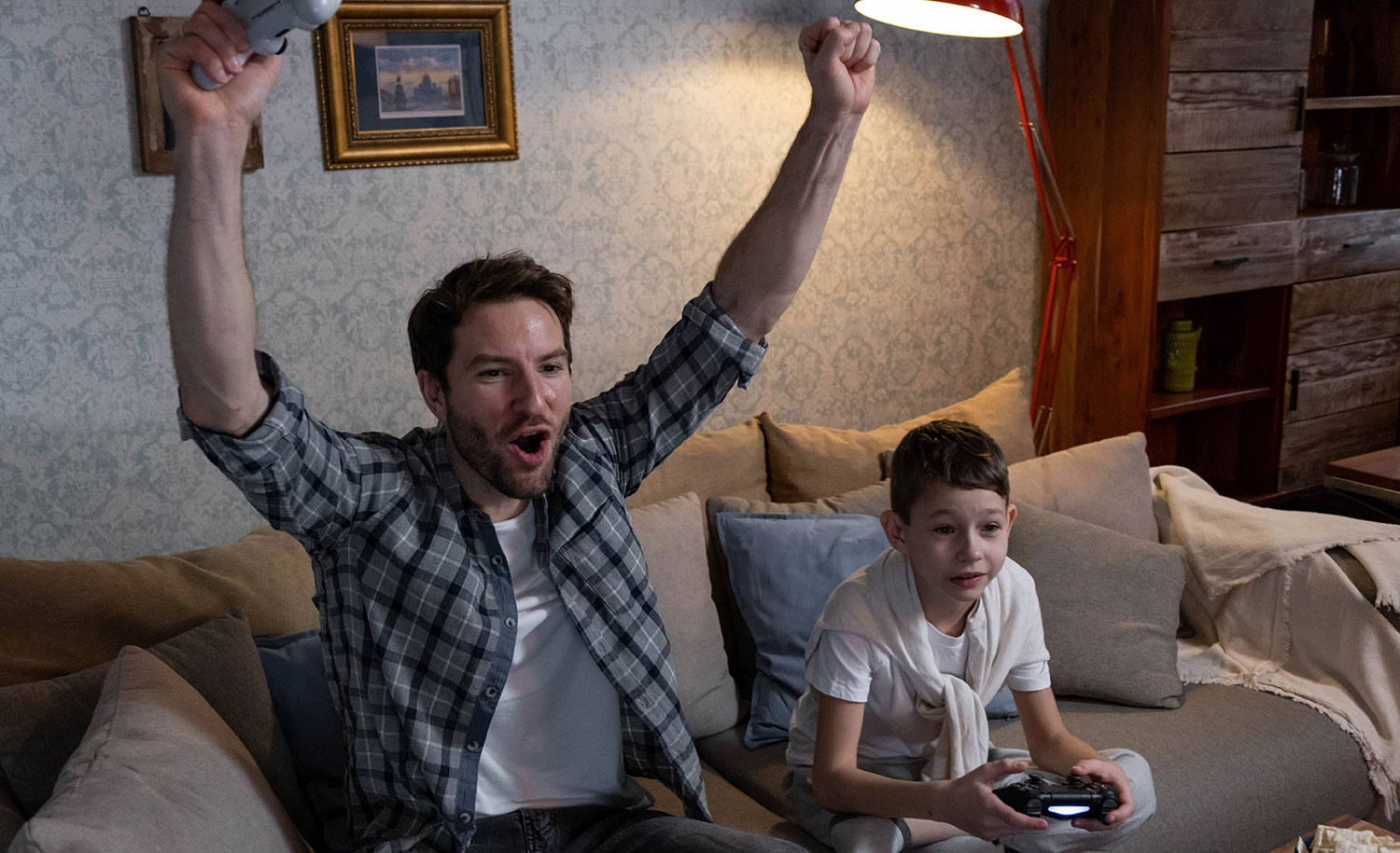 An introvert plays video games with a child