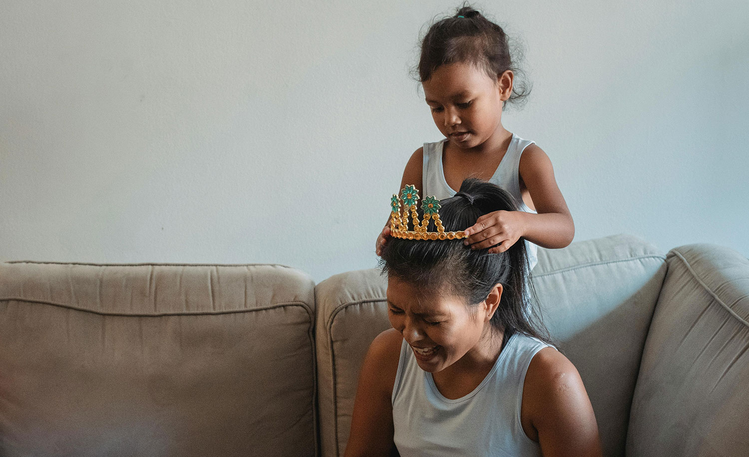 A mother plays with her introverted child
