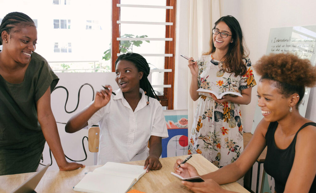Coworkers laugh at a team-building retreat