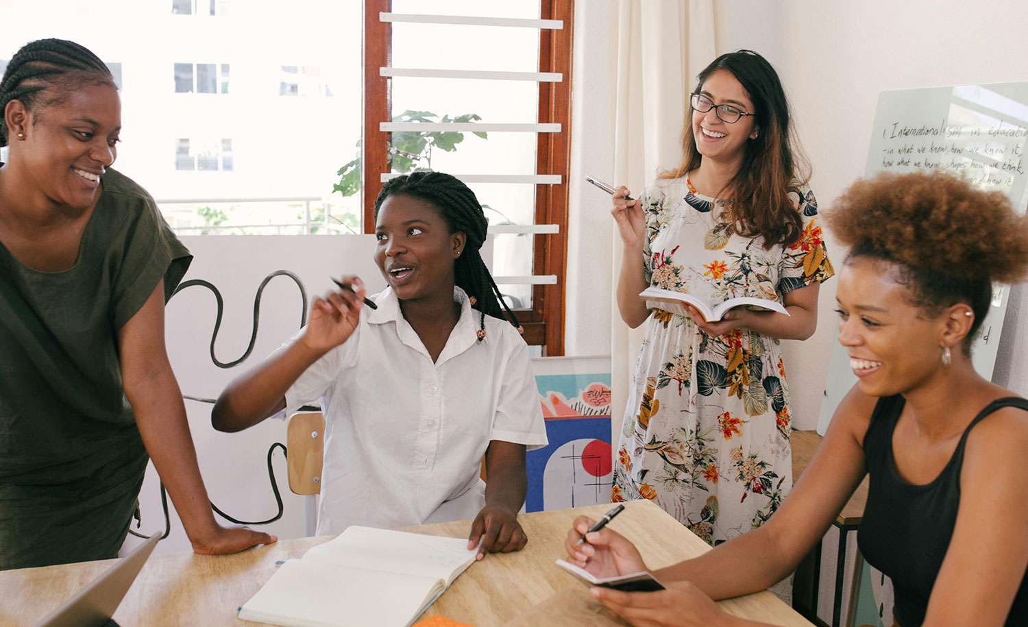 Coworkers laugh at a team-building retreat