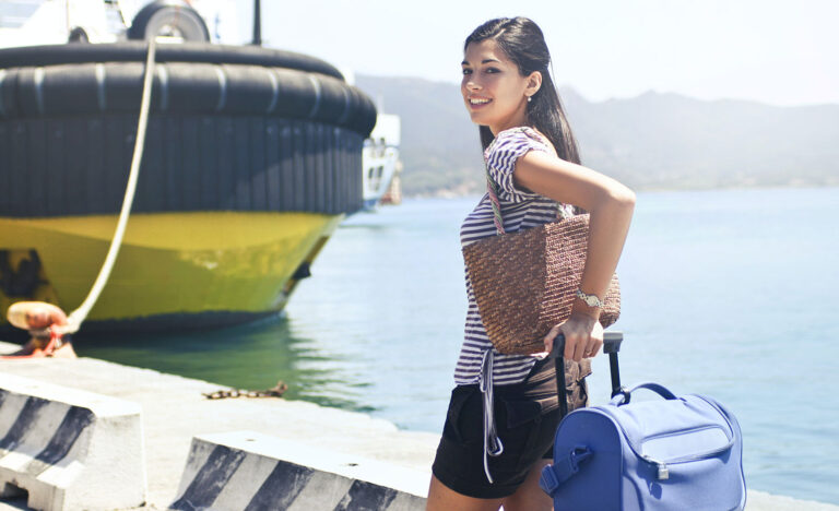 A woman heads to a cruise ship