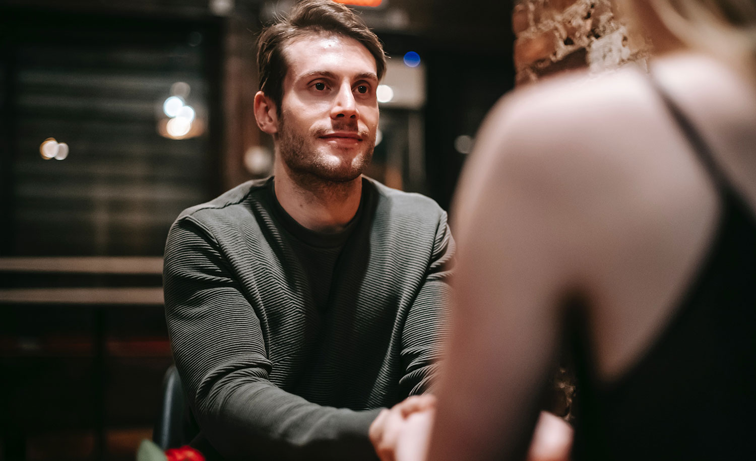 An introvert talks to his date across the table