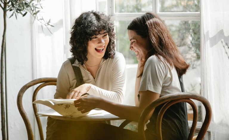 An introvert laughs with her friends