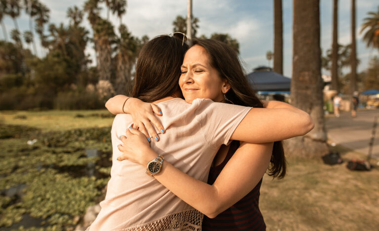 An introvert hugs her friend