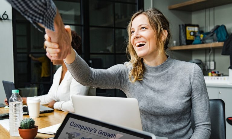 an INFJ and INTJ shake hands at work
