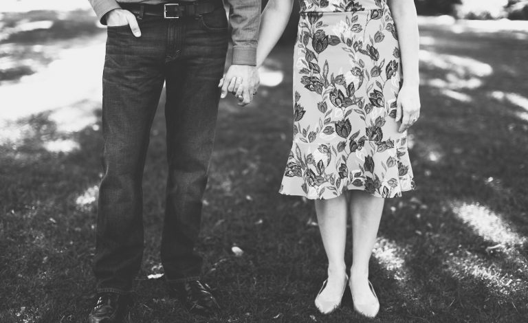 introvert holds hands with her partner