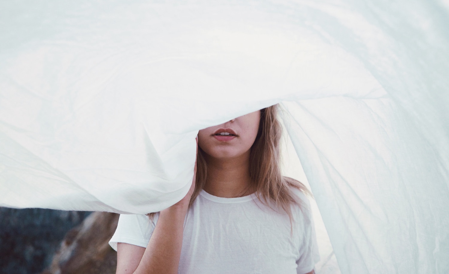 a socially anxious introvert hides her face