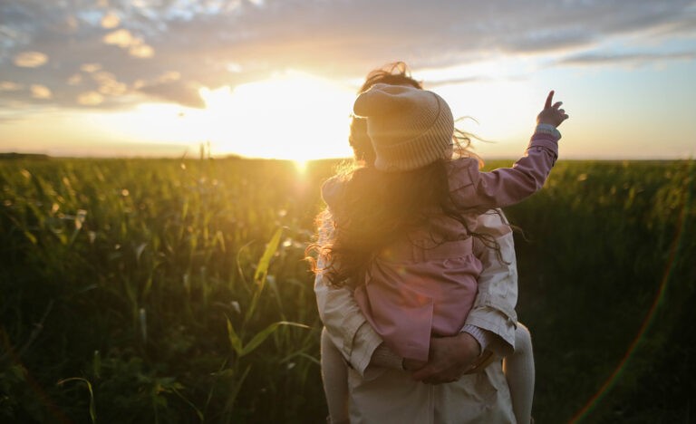 A single father high-fives his daughter