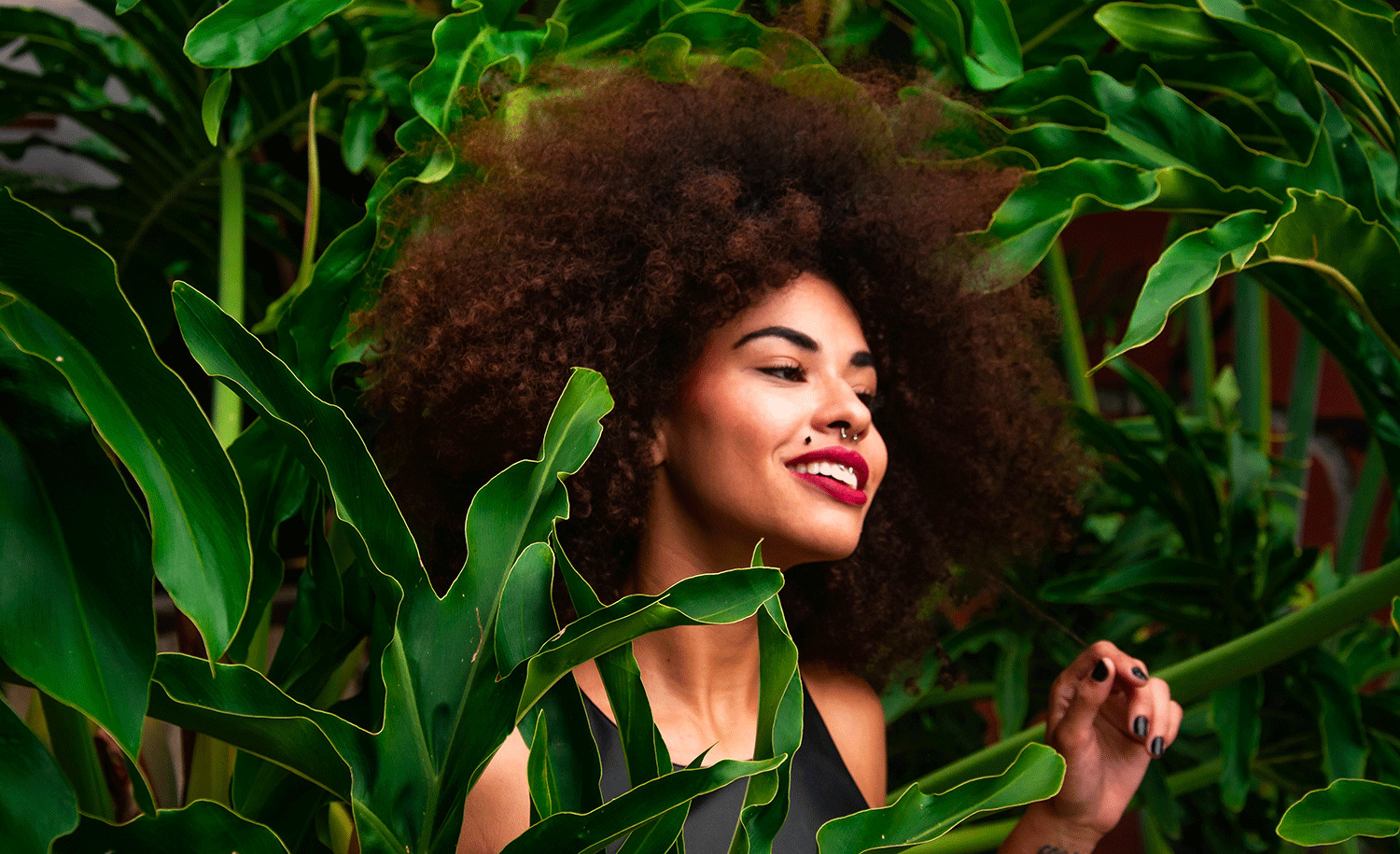 A highly sensitive introvert stands among greenery