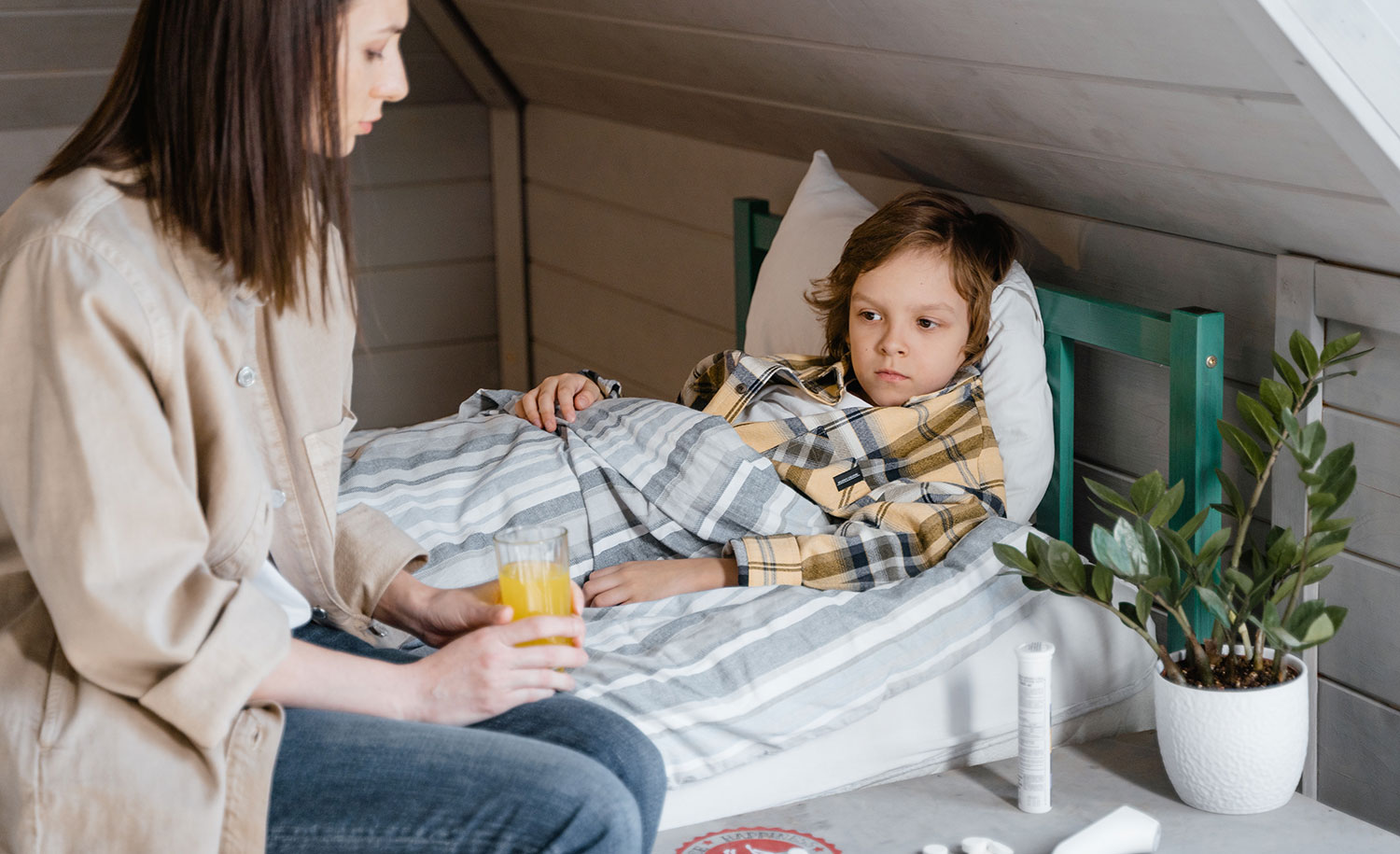 A mother comforts her introverted and anxious child, who refuses to go to school